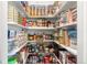 Well-stocked pantry featuring an array of food items and organized shelving, providing ample storage for kitchen essentials at 5745 S Andes St, Aurora, CO 80015