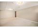 Large basement with neutral paint, carpet, and basic lighting fixtures at 2526 W 39Th Ave, Denver, CO 80211