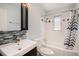 Bathroom with shower-tub combination with mosaic tile sink and mirror at 2526 W 39Th Ave, Denver, CO 80211