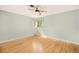 Bright and airy bedroom featuring hardwood floors and a large window at 2526 W 39Th Ave, Denver, CO 80211