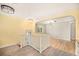 Open-concept hallway featuring hardwood floors and bright paint at 2526 W 39Th Ave, Denver, CO 80211