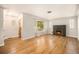 Bright living room with hardwood floors, fireplace, and a large picture window at 2526 W 39Th Ave, Denver, CO 80211