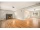 Bright living room features hardwood floors, a fireplace, and an open floor plan at 2526 W 39Th Ave, Denver, CO 80211