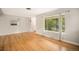 Inviting living room with hardwood floors, a large window, and neutral paint colors at 2526 W 39Th Ave, Denver, CO 80211