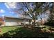 Backyard with a deck and mature trees at 308 Baron Ave, Lafayette, CO 80026