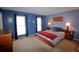 Bright bedroom with a king size bed and two windows at 308 Baron Ave, Lafayette, CO 80026