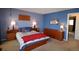 Bedroom with king size bed and two side tables at 308 Baron Ave, Lafayette, CO 80026