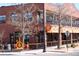 Exterior view of Tangerine Restaurant with brick facade and orange awnings, offering brunch and lunch at 308 Baron Ave, Lafayette, CO 80026