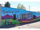 Colorful mural in Lafayette with 'Greetings From Lafayette' text and buffalo art at 308 Baron Ave, Lafayette, CO 80026