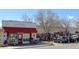An inviting store front with a red awning and sidewalk, offering art gallery and teaching studio services at 308 Baron Ave, Lafayette, CO 80026