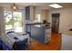Well-equipped kitchen featuring stainless steel appliances, two-tone cabinets, and adjacent dining area at 308 Baron Ave, Lafayette, CO 80026