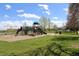 Neighborhood playground with play structures, swings, a picnic bench, and open green space at 308 Baron Ave, Lafayette, CO 80026