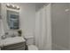 Bright bathroom featuring white subway tile, gray vanity, and a shower with curtain at 5120 Williams Fork Trl # 210, Boulder, CO 80301