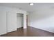 Bedroom with hardwood floors and open closet with double doors at 5120 Williams Fork Trl # 210, Boulder, CO 80301