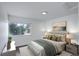 Stylishly furnished bedroom with warm hardwood floors and window view at 5120 Williams Fork Trl # 210, Boulder, CO 80301