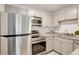A kitchen showcasing stainless steel appliances, granite countertops, and light gray cabinets at 5120 Williams Fork Trl # 210, Boulder, CO 80301
