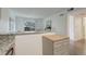 Kitchen view highlighting counter seating, island, and view to living room at 5120 Williams Fork Trl # 210, Boulder, CO 80301