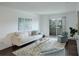 Bright living room featuring sleek furniture, modern decor, and a patio door at 5120 Williams Fork Trl # 210, Boulder, CO 80301