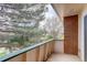 Balcony view with a partial view of the surrounding trees and building at 5120 Williams Fork Trl # 210, Boulder, CO 80301