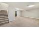 Unfinished basement area with stairs, and ample open space, ready for customization at 13003 W 20Th Ave, Golden, CO 80401