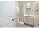 Cozy bathroom with a single vanity, toilet, and a towel bar at 13003 W 20Th Ave, Golden, CO 80401