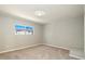 This bedroom features neutral paint, carpet, and a window to provide ample natural light at 13003 W 20Th Ave, Golden, CO 80401