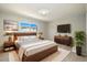 Spacious bedroom with stylish furniture, window view, and modern décor at 13003 W 20Th Ave, Golden, CO 80401