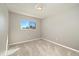 Empty bedroom with neutral walls, carpet, and a bright window view at 13003 W 20Th Ave, Golden, CO 80401