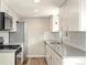 Modern kitchen with stainless steel appliances, subway tile backsplash, and updated fixtures at 13003 W 20Th Ave, Golden, CO 80401