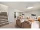 Spacious living room featuring modern furniture, carpeted floors, and ample lighting at 13003 W 20Th Ave, Golden, CO 80401