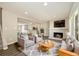 Inviting living room featuring a fireplace, two chairs, a couch and recessed lighting at 13003 W 20Th Ave, Golden, CO 80401