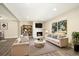 Comfortable living room featuring a fireplace, a couch, and two chairs at 13003 W 20Th Ave, Golden, CO 80401