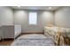 Basement bedroom with crib and twin bed at 476 S Newport Way, Denver, CO 80224