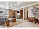 A large basement living room features a fireplace, tiled floors, a recessed lighting, and a seating area at 40121 County Road 21, Elizabeth, CO 80107