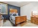 Comfortable bedroom with carpeted floors, a window, a charming bed frame, and bright, natural light at 40121 County Road 21, Elizabeth, CO 80107