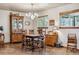 A dining room with vintage furniture, including a wooden table, chairs, and antique cabinets at 40121 County Road 21, Elizabeth, CO 80107