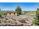 Property with outbuildings, garden plots, and mature landscaping at 40121 County Road 21, Elizabeth, CO 80107