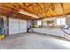 Spacious garage featuring ample lighting, work space, and storage cabinets at 40121 County Road 21, Elizabeth, CO 80107