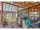 Bright greenhouse with work bench, storage shelves, and translucent ceiling at 40121 County Road 21, Elizabeth, CO 80107