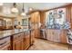 An inviting kitchen featuring custom cabinetry, granite countertops, and a stainless steel dishwasher at 40121 County Road 21, Elizabeth, CO 80107