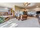 Expansive living room featuring a view of the entryway and a cozy seating area with natural light at 40121 County Road 21, Elizabeth, CO 80107