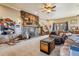 Comfortable living room featuring a stone fireplace, plush seating, and a cozy, inviting atmosphere at 40121 County Road 21, Elizabeth, CO 80107