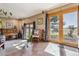 Inviting living room featuring large windows, natural light, and access to the outdoors at 40121 County Road 21, Elizabeth, CO 80107