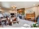 Spacious living room with stone fireplace, plush seating, and natural light creating a relaxing ambiance at 40121 County Road 21, Elizabeth, CO 80107