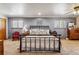 Serene main bedroom with ample natural light, neutral tones, and comfortable furnishings at 40121 County Road 21, Elizabeth, CO 80107