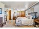 Spacious bedroom with double closets, an ensuite bathroom, carpeted floors, and lots of natural light at 40121 County Road 21, Elizabeth, CO 80107