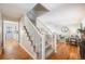 Clean, bright staircase with white railings and carpeted steps at 6482 E Costilla Pl, Centennial, CO 80112