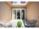 Private back patio has pavers, fencing, sliding glass door, and two chairs at 8571 Gold Peak Dr # F, Highlands Ranch, CO 80130