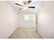 Bright bedroom with neutral walls, soft carpet, and a ceiling fan at 8571 Gold Peak Dr # F, Highlands Ranch, CO 80130