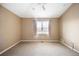 Bright bedroom with neutral walls, soft carpet, and a window with blinds at 8571 Gold Peak Dr # F, Highlands Ranch, CO 80130